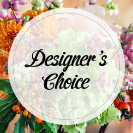 Colorful floral arrangement with a "Designer’s Choice" sign