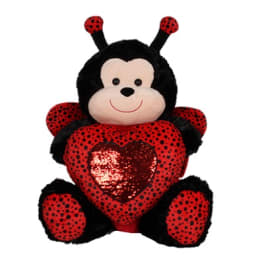 Plush ladybug holding a red heart