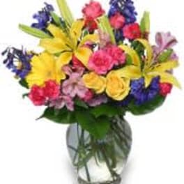 Colorful mixed bouquet in a clear glass vase