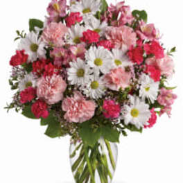 Pink and white mixed bouquet in a clear glass vase