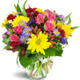 Colorful mixed bouquet in a clear glass vase