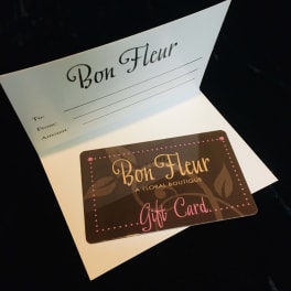Bon Fleur floral boutique gift card displayed in an open white card holder.