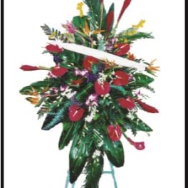 Tall tropical floral standing spray with red blooms on a stand