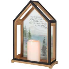 House-shaped lantern with a candle and memorial quote