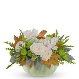 Pumpkin-shaped floral arrangement with white roses and white blossoms