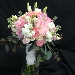 Pink and white bouquet in a clear glass vase