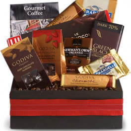 Assorted chocolate bars arranged in a gift box with a red ribbon