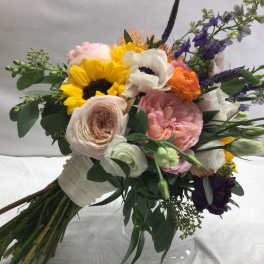 Mixed bouquet with sunflowers, roses, and white blooms