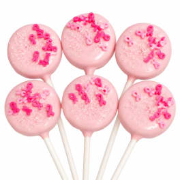 Pink cake pops decorated with breast cancer ribbons