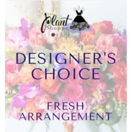 Designer’s choice fresh flower arrangement with pink and peach blooms