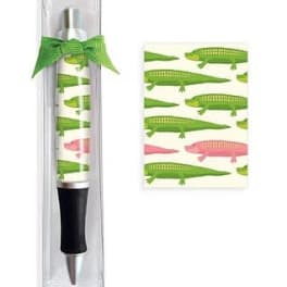 Pen in clear packaging with green crocodile pattern and bow