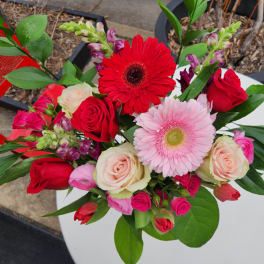 Bouquet of red and pink flowers with roses and gerbera daisies