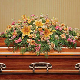 Large floral spray on a wooden casket