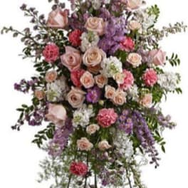 Tall standing floral spray with pink roses and purple flowers