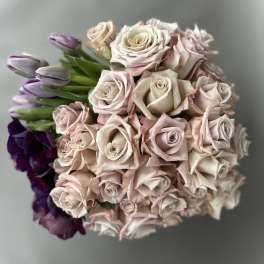 Bouquet of pale pink roses with purple tulips