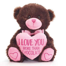 Brown teddy bear holding a pink heart with text