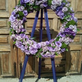 Purple floral wreath on a standing easel