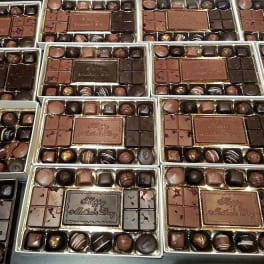Boxes of assorted chocolates arranged in rows