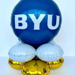 Blue BYU balloon arrangement with white and gold balloons