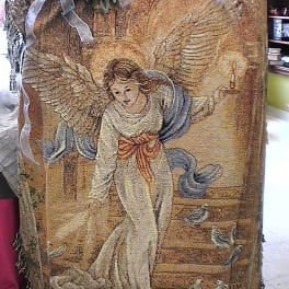 Decorative tapestry with an angel figure and ribbon bow