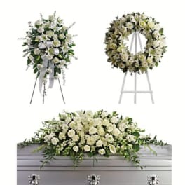 White floral funeral spray, wreath, and casket arrangement