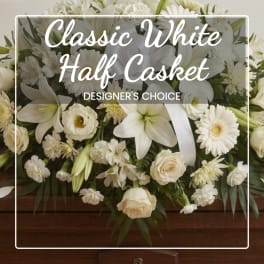 White casket spray with lilies, roses, and daisies