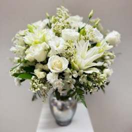 White floral bouquet in a silver vase