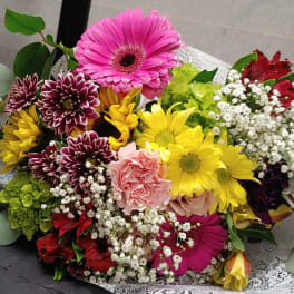 Colorful mixed bouquet with gerbera daisies, carnations, and baby's breath