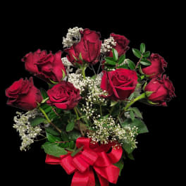 Bouquet of red roses with baby's breath and a red ribbon