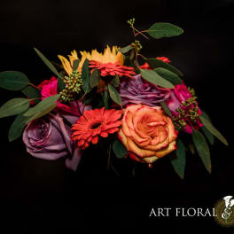 Colorful bouquet of roses and gerbera daisies with greenery