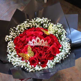 Red rose bouquet with white baby's breath and decorative butterflies