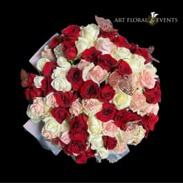 Bouquet of red, white, and blush roses with butterfly accents