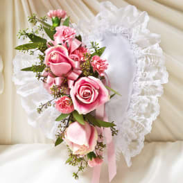 Pink rose corsage with lace trim and ribbon