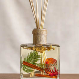 Glass reed diffuser with dried botanicals and cinnamon sticks