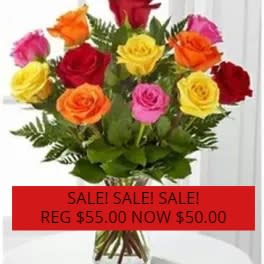 Bouquet of multicolored roses with greenery