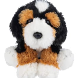 Plush dog toy with black, white, and tan fur
