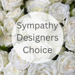 White roses with a "Sympathy Designers Choice" label