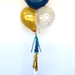 Blue, gold, and clear balloons with BYU text and tassels