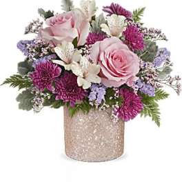 Pink roses and purple flowers in a glittery vase