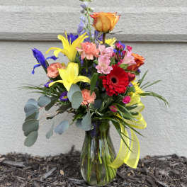Colorful mixed bouquet in a clear glass vase