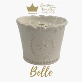 White ceramic jar candle with scalloped rim and embossed fleur-de-lis design