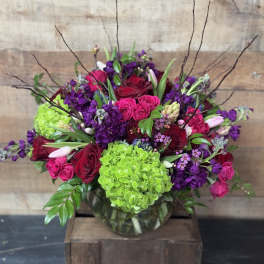 Bouquet of pink and purple flowers in a glass vase