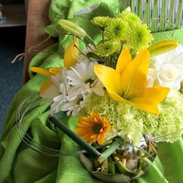 Bouquet of yellow lilies, white daisies, and green chrysanthemums