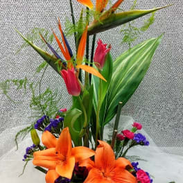 Tall tropical bouquet with orange lilies and pink tulips