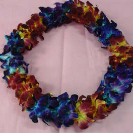 Colorful flower lei made of clustered blossoms on pink paper