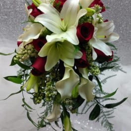 Bouquet of white lilies, red roses, and white calla lilies