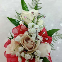 Small bouquet of cream roses with red ribbon and white filler flowers