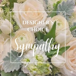 Cream-colored bouquet with roses, ranunculus, and white blooms