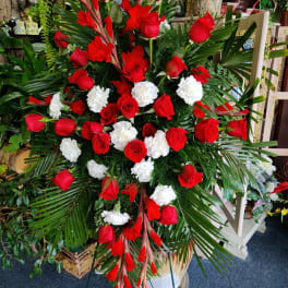 Large standing floral spray with red roses and white carnations