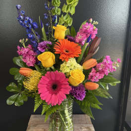 Colorful mixed bouquet in a clear glass vase